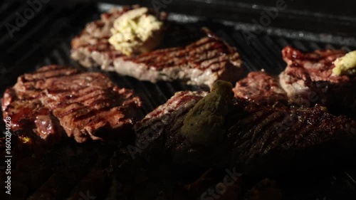 Cooking beef steak Juicy gill steak sizzling on an open flame grill with smoke