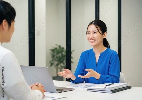 Smiling  businesswoman in an engaging business discussion.

