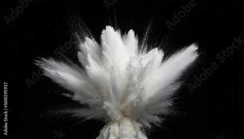 White powder explosion against black background. Resembles snow or smoke with dynamic motion. Fine particles disperse in a captivating blast, ideal for abstract backgrounds or visual effects.
