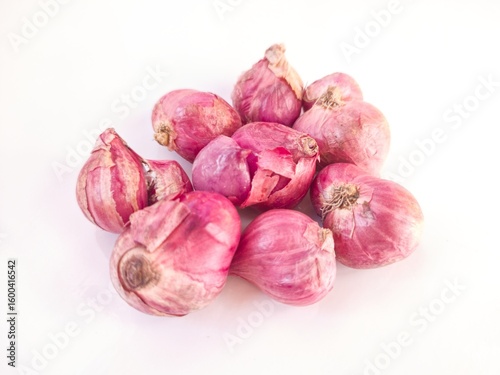 Group of red shallots on white background
