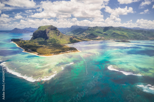Aerial view of a breathtaking underwater waterfall illusion cascading into the depths of the Indian Ocean near Le Morne Brabant, Le Morne, Mauritius.