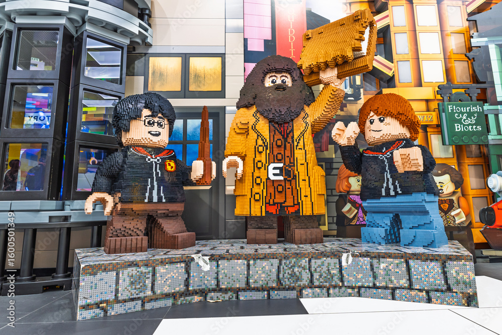 Fototapeta premium Giant Lego sculptures of wizarding heroes on display in colorful toy store. London, UK, 2 June 2024