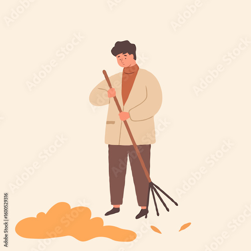 Man raking leaves while standing on light background  