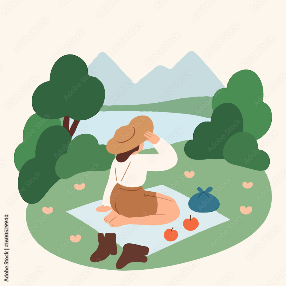 Fototapeta premium Woman sitting on picnic blanket enjoying nature by the lake 