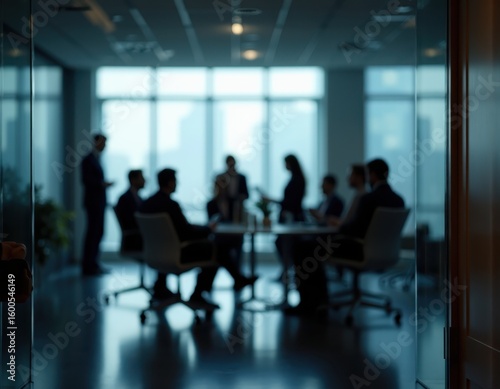 Group of businesspeople negotiating gathered in modern conference room blurred silhouettes view meeting behind closed glass doors Business communication workflow decision-making strategy sharing