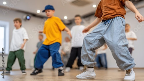 Children learning hip-hop and modern dance at a dance school, close-up of legs