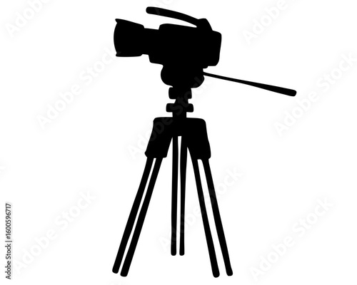 Professional video camera on tripod silhouette