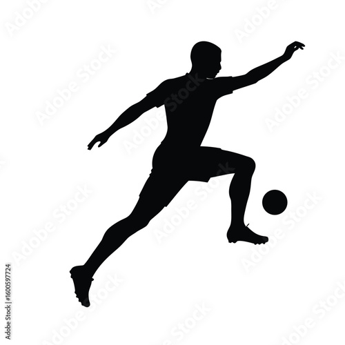 Soccer player silhouette in kicking action