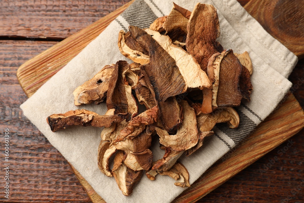 Fototapeta premium Dried chanterelle mushrooms on wooden table, top view
