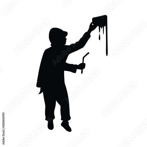 Graffiti artist silhouette painting a wall