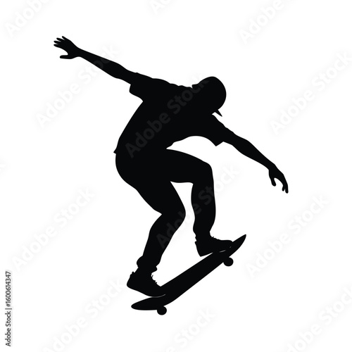 Silhouette of a skateboarder doing a trick