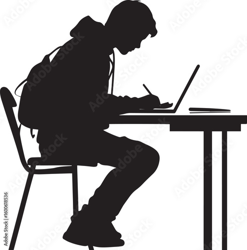 A student writing notes in a notebook or on a laptop while seated at a desk.