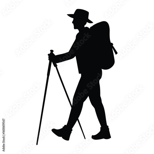 Silhouette of a hiker with a backpack and trekking poles walking