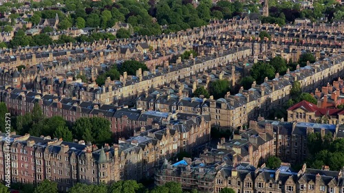 Aerial video of traditional stone tenement buildings in a leafy residential area of Marchmon in Edinburgh - Scotland. 