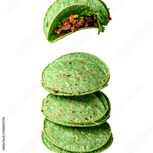Stack of colorful green tortillas with filling food photography