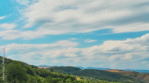 Nature landscape clouds rolling over hills and mountains time-lapse