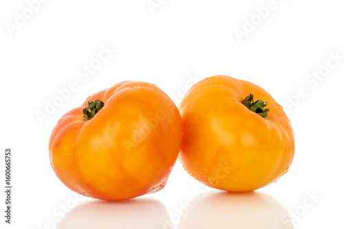 Yellow juicy tomatoes isolated on white background, close-up.