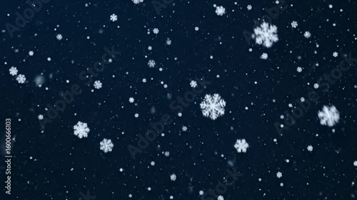 Snowflakes fall on a dark blue backdrop varying in size  density
