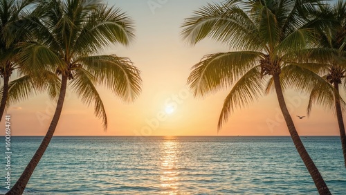 A serene beach dawn scene with trees bordering the water and a clear horizon.