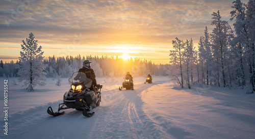 Snowmobiling adventure at sunset with three people riding through a winter wonderland landscape, featuring a snow covered forest.