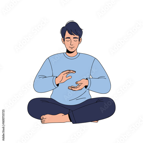 Man sitting cross legged in meditation pose practicing mindfulness and inner peace