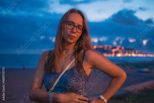 Woman on the night beach at...