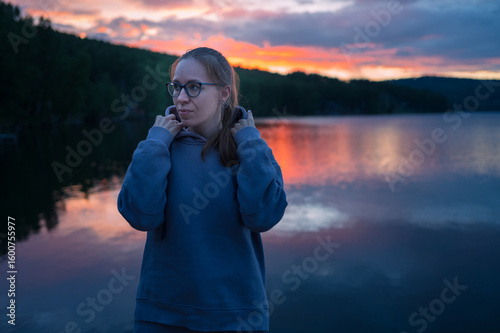 Woman sitting on the pier, ...