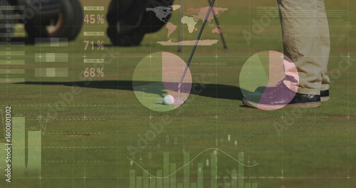 Bild auf Leinwand Male golfer aligning putter next to golf ball on putting green, displaying data