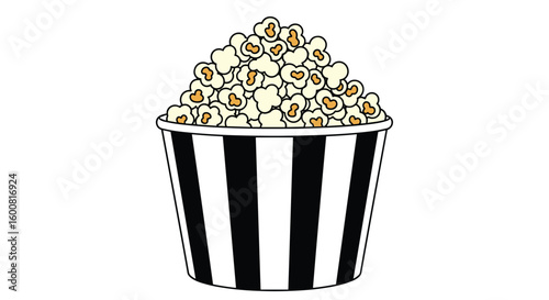 A bucket filled with fluffy white popcorn for a movie night with black and white stripes on the bucket