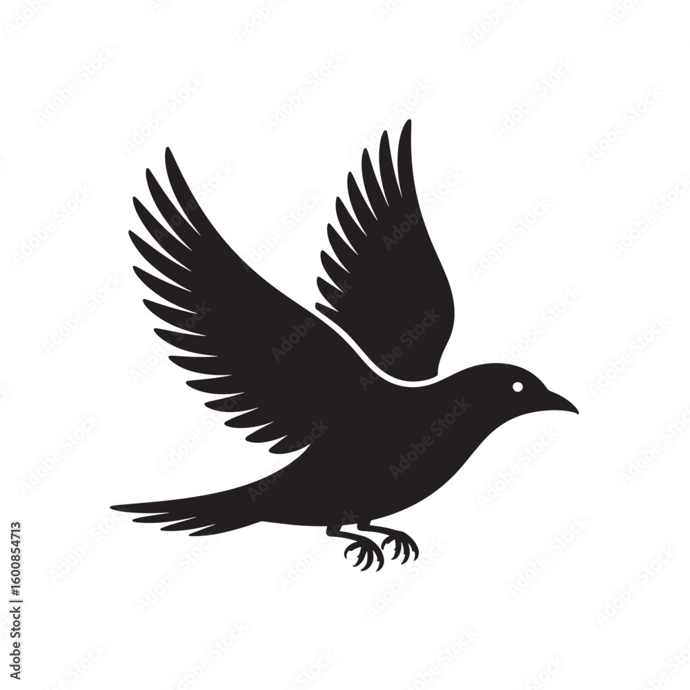Fototapeta premium Silhouette of a black bird with outstretched wings in mid flight isolated on white background