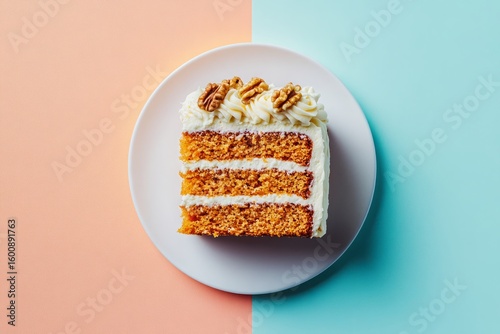 Slice of moist carrot cake with cream cheese frosting on pastel background, flat lay.