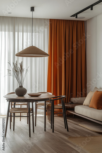 Modern dining space with natural textures and bold orange curtains