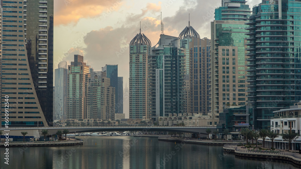 Obraz premium View of Dubai Marina towers and canal in Dubai morning timelapse