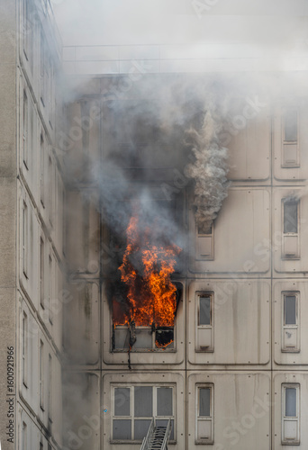 Gennevilliers, France - 07 14 2025: Detail view of the facade of a burning building