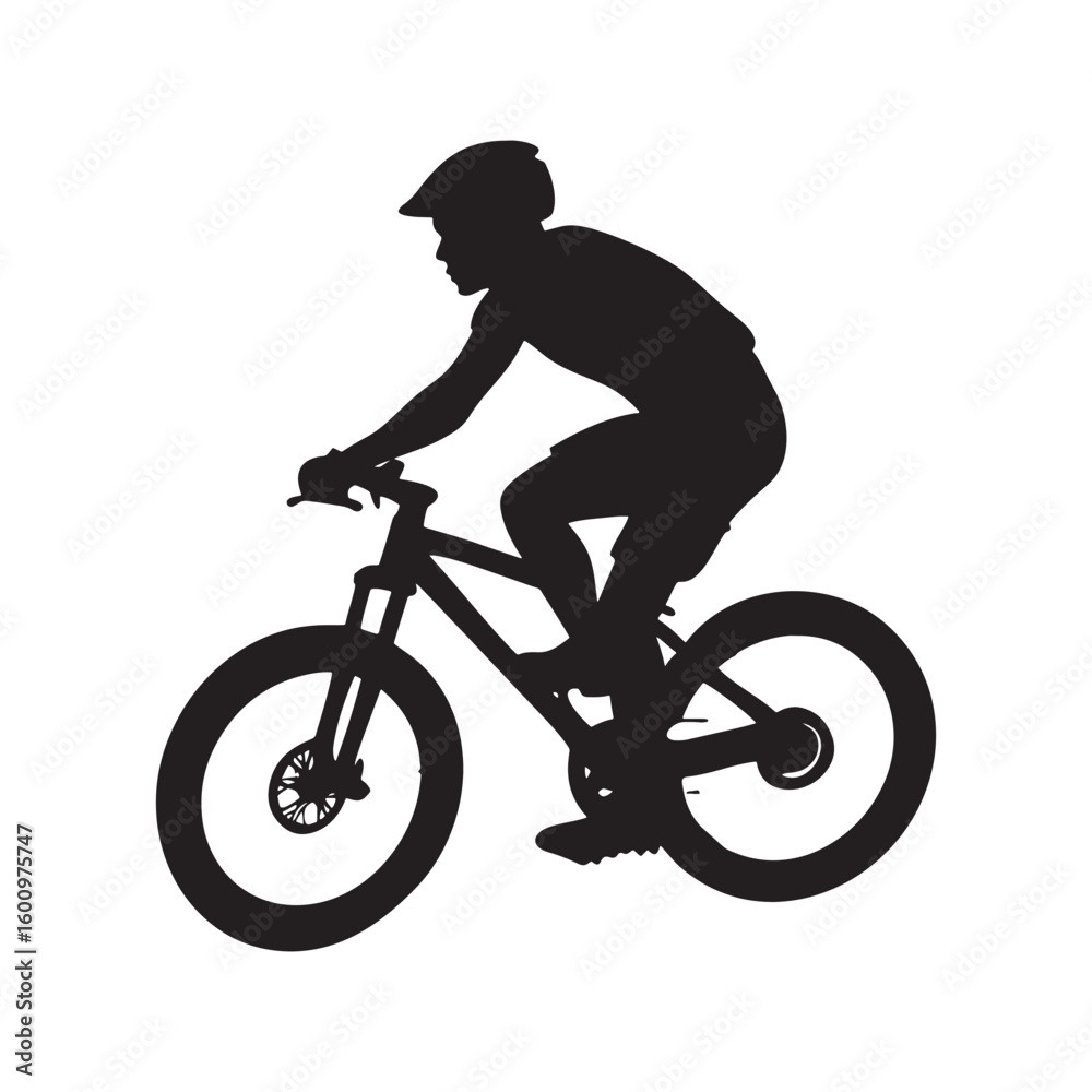 Obraz premium Silhouette of a cyclist riding a mountain bike on a trail