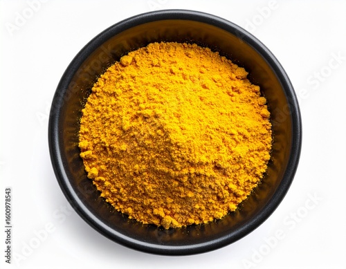 Golden Turmeric Powder in Black Bowl Top View.