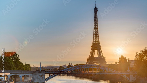 Eiffel Tower sunrise timelapse with boats on Seine river and in Paris, France.