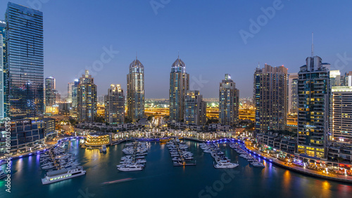 Slika na platnu Dubai Marina skyscrapers aerial day to night timelapse, port with luxury yachts