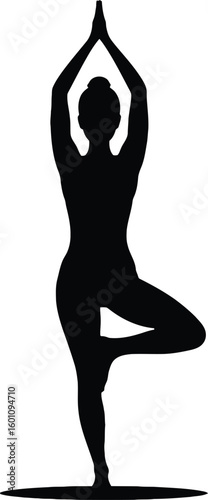 Elegant woman in yoga tree pose silhouette demonstrating balance and serenity