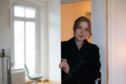 businesswoman looking out window