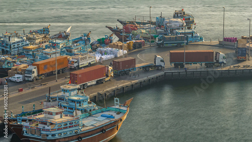 Quadro su tela Loading a ship in Port Said timelapse in Dubai, UAE.
