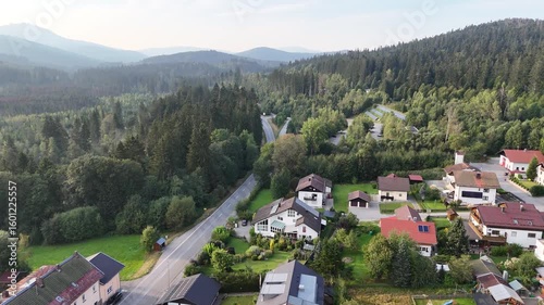 Flight over village Ludwigsthal (Lindberg) towards Bavarian Forest National Park Falkenstein with mountain panorama, Germany