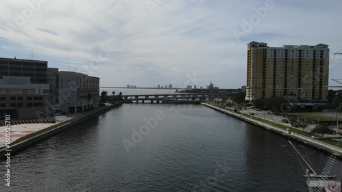 Wallpaper Mural Drone flies southwest along river with a pirate ship docked in Tampa, Florida, USA Torontodigital.ca