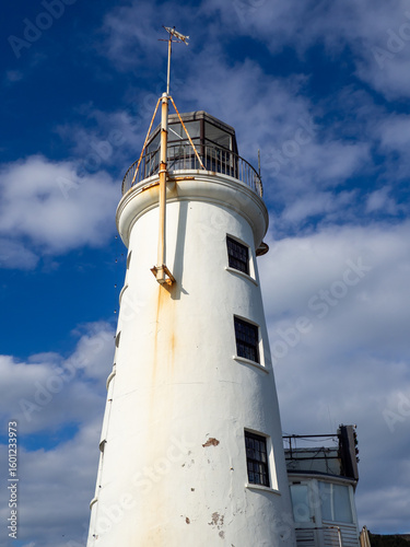 Scarborough lighthouse built in 1806 on vincent pier against a blue summer sky