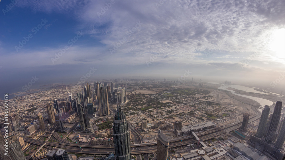 Obraz premium Downtown of Dubai in the morning timelapse after sunrise. Aerial view with towers and skyscrapers