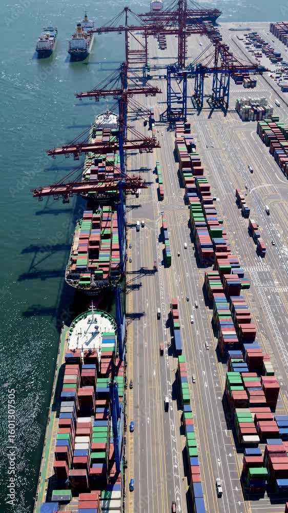 Aerial view of a bustling port with colorful shipping containers and ...