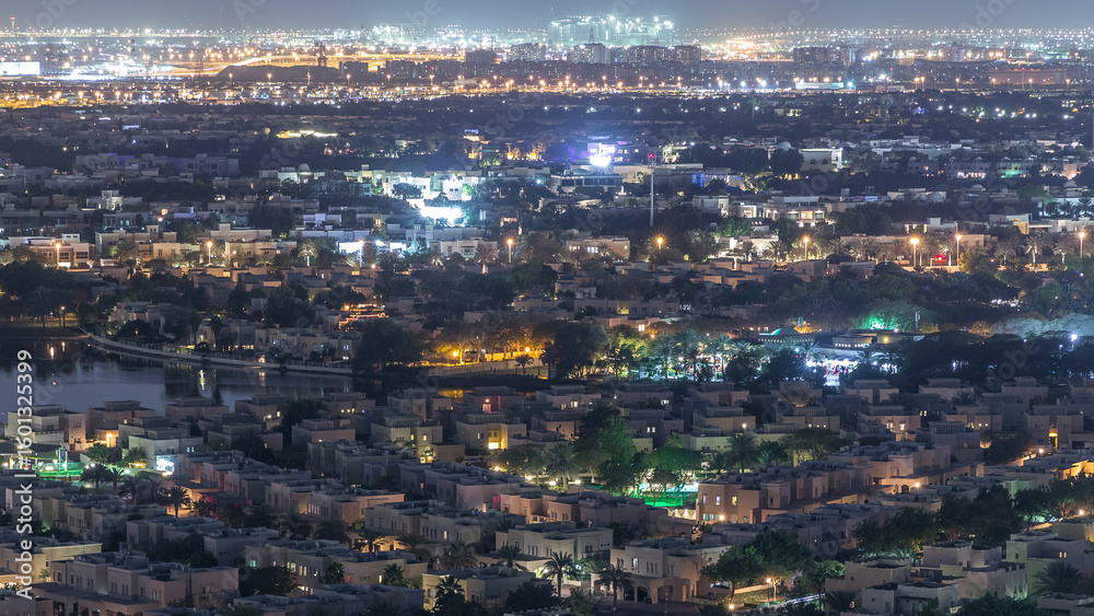 Obraz premium Aerial view to villas and houses with Golf course night timelapse