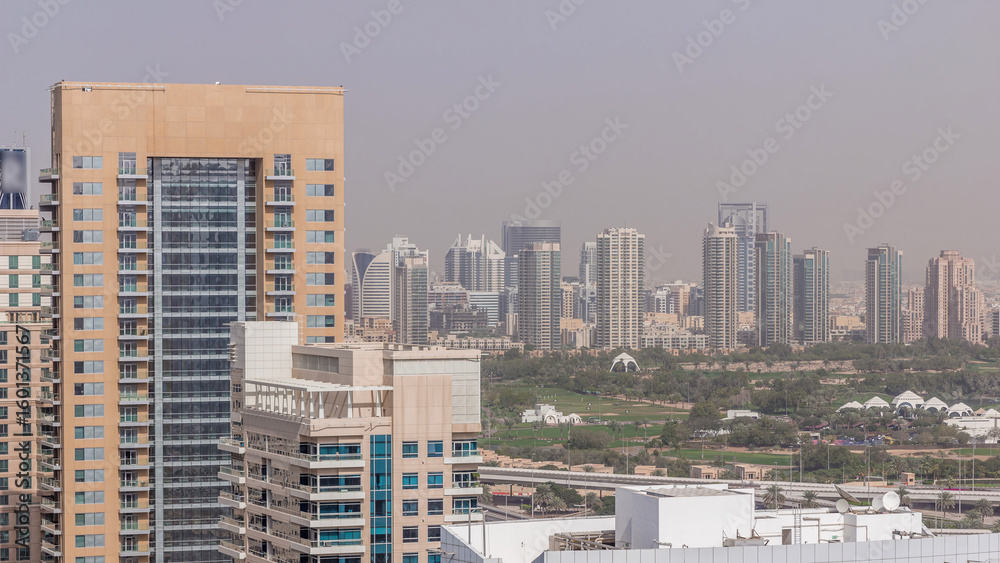 Dubai Golf Course with a cityscape of Greens and tecom districts at the background aerial timelapse Dubai Golf Course with a cityscape of Greens and tecom districts at the background aerial timelapse