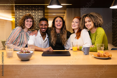 Friends enjoying breakfast together with laughter