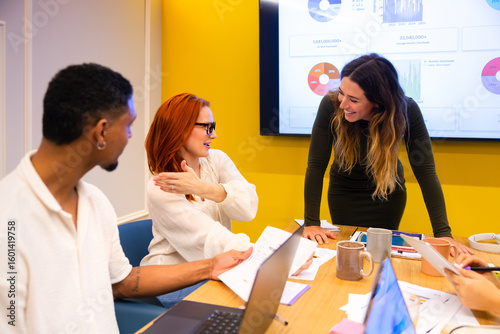 Collaborative team meeting with digital presentations